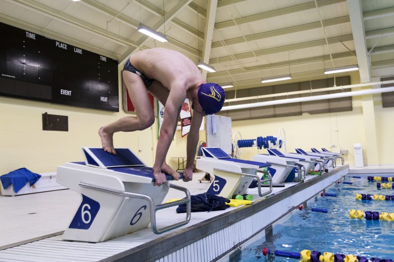 alec Elliot prepares to take the plunge into the Wilfrid Laurier University Olymic sized swimming pool before heading to Rio (Paige Bush/ Photo Editor)
