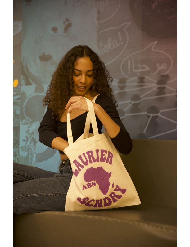 Photo of model Imani van Gaalen holding a Laurier bag, by Michael Manful.