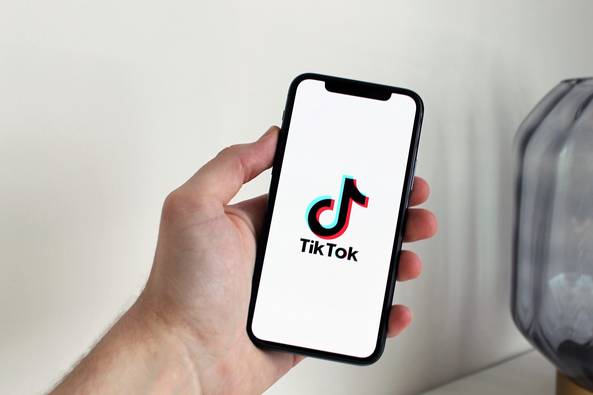 Image of phone with TikTok logo