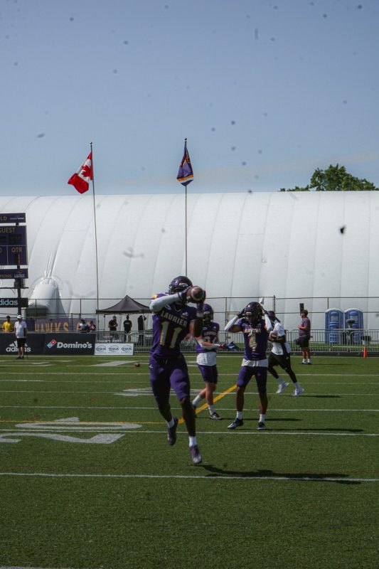 Laurier Football player about to throw ball