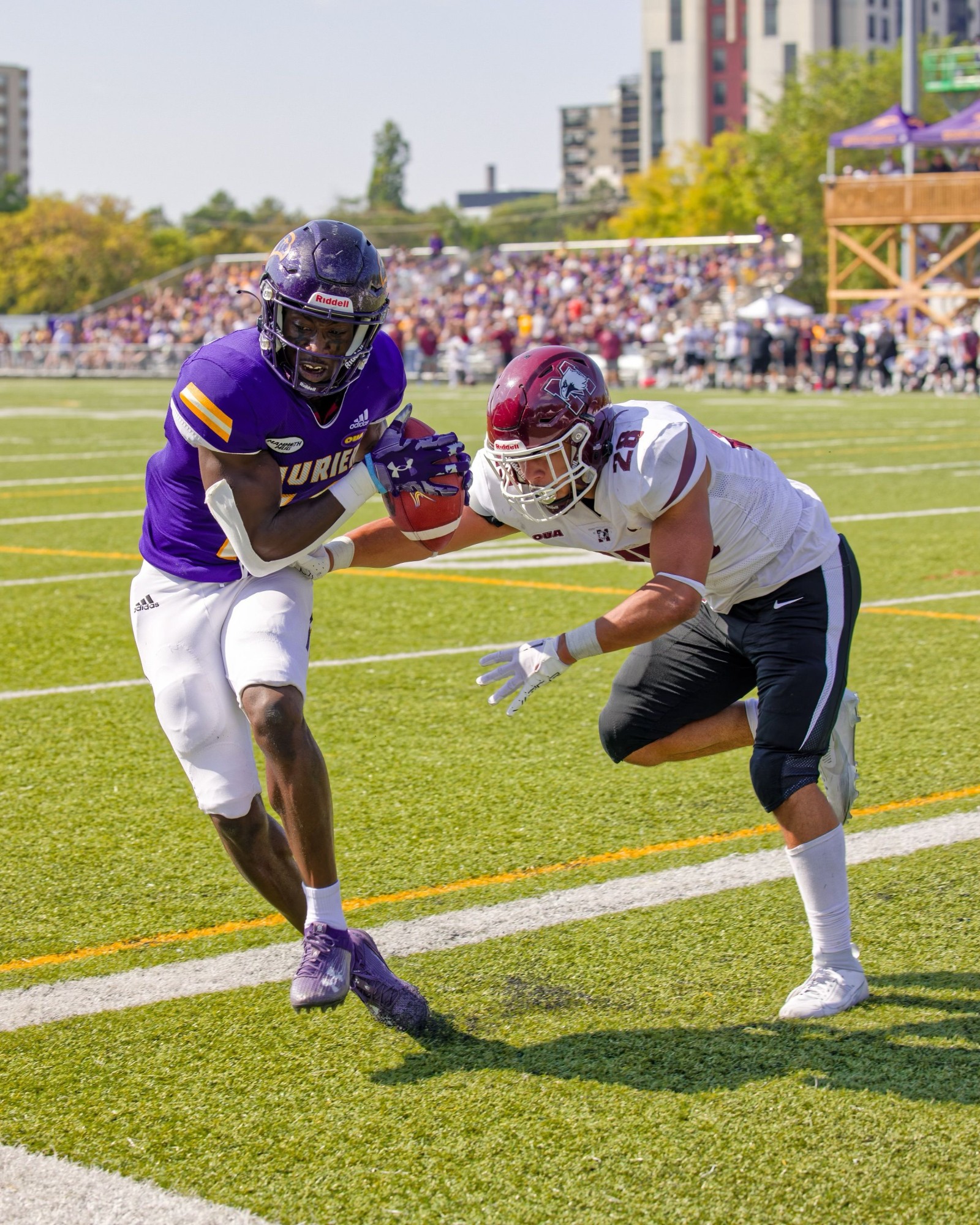 Laurier football player running with the ball
